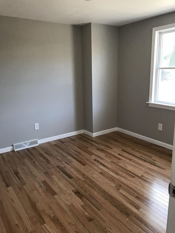 635 Piper Road West Springfield, MA 01089 - Photo 15 of 24 a view of empty room with wooden floor and fan