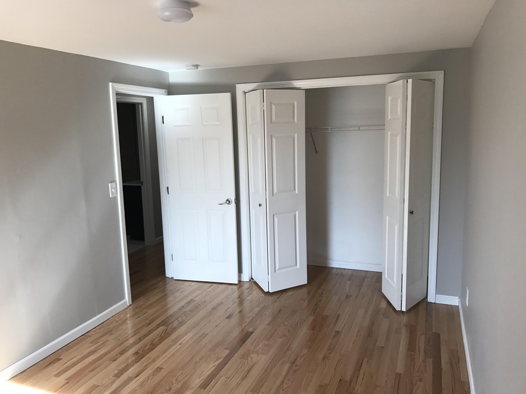 635 Piper Road West Springfield, MA 01089 - Photo 16 of 24 an empty room with wooden floor and closet area