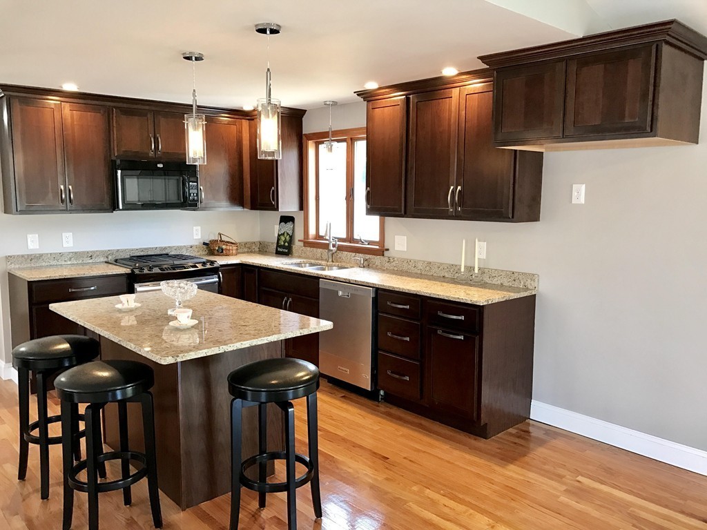 635 Piper Road West Springfield, MA 01089 - Photo 2 of 24 a kitchen with kitchen island granite countertop a sink counter and chairs