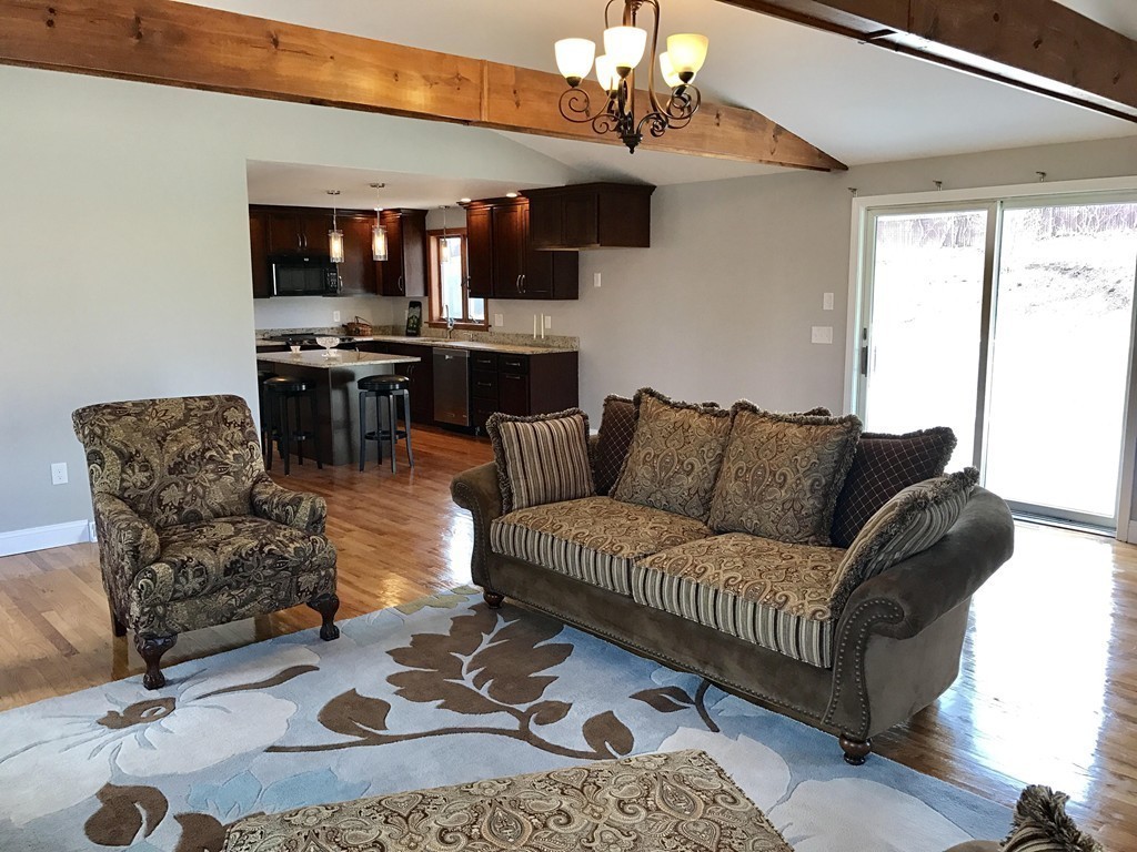 635 Piper Road West Springfield, MA 01089 - Photo 5 of 24 a living room with furniture a dining table and kitchen view