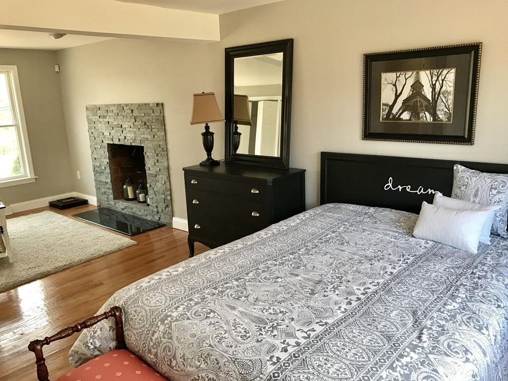 635 Piper Road West Springfield, MA 01089 - Photo 6 of 24 a bedroom with a bed and a fireplace