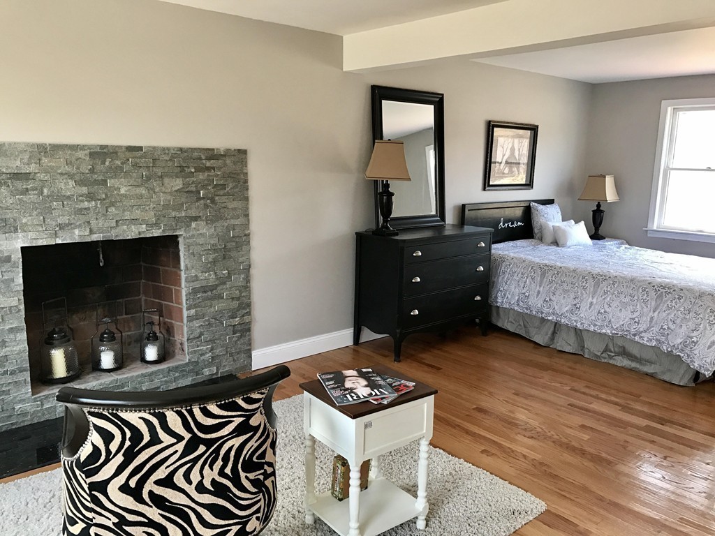 635 Piper Road West Springfield, MA 01089 - Photo 7 of 24 a bedroom with a bed and a fireplace