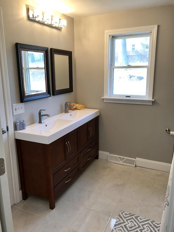635 Piper Road West Springfield, MA 01089 - Photo 9 of 24 a bathroom with a sink vanity and mirror