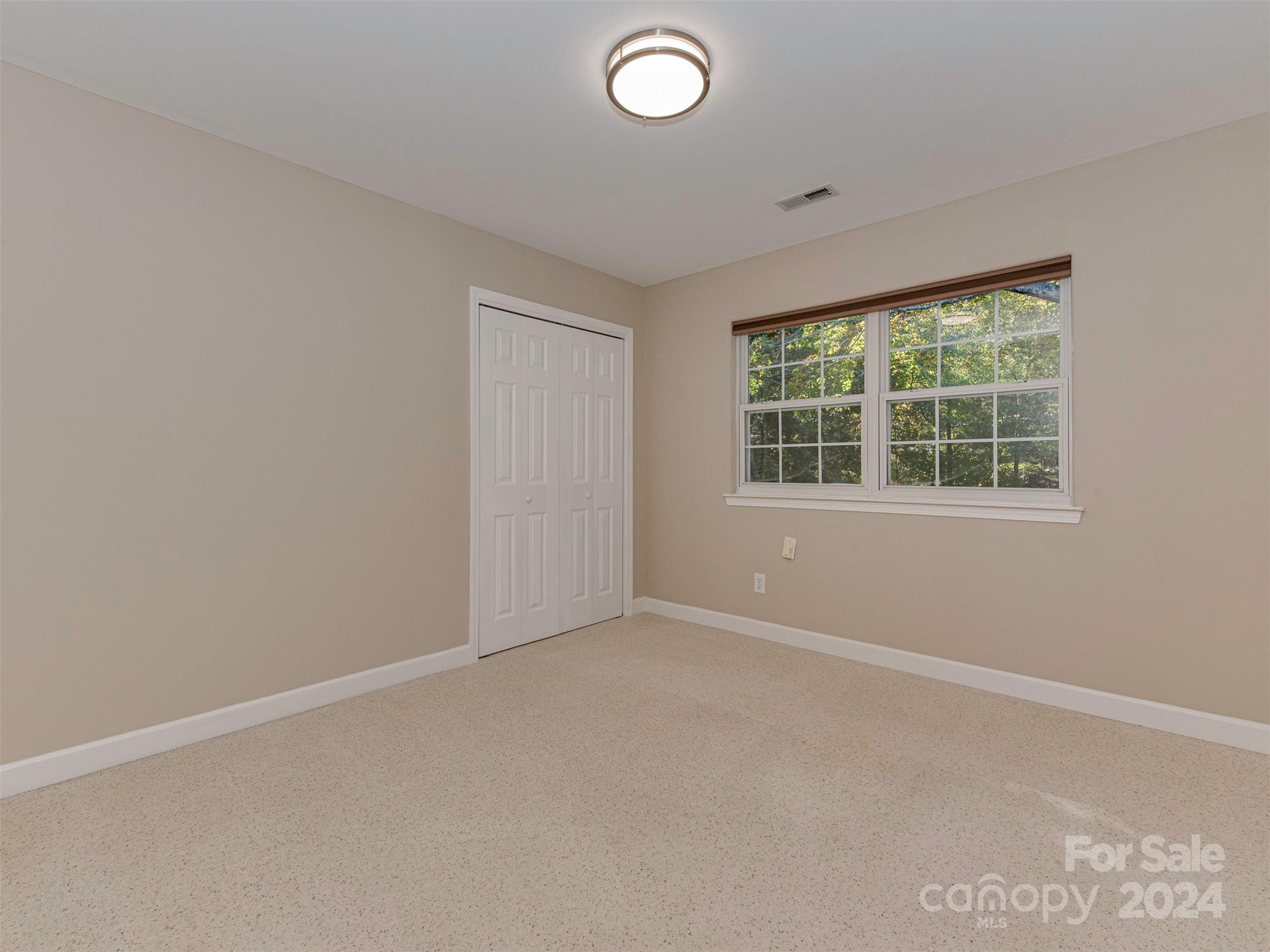 4801 Steepleton Way Charlotte, NC 28215 - Photo 13 of 28 an empty room with a window