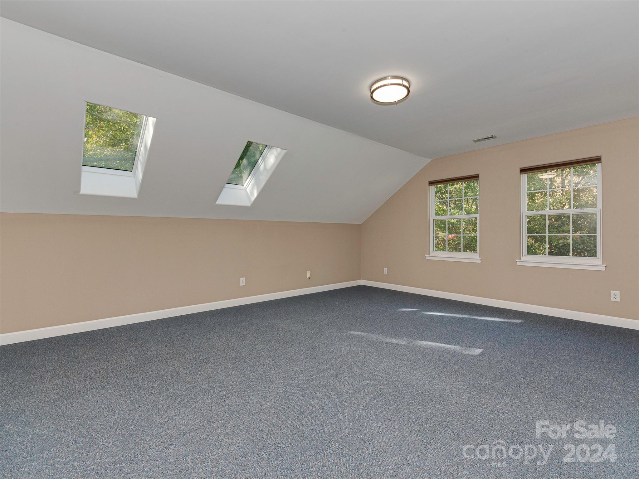 4801 Steepleton Way Charlotte, NC 28215 - Photo 14 of 28 an empty room with windows