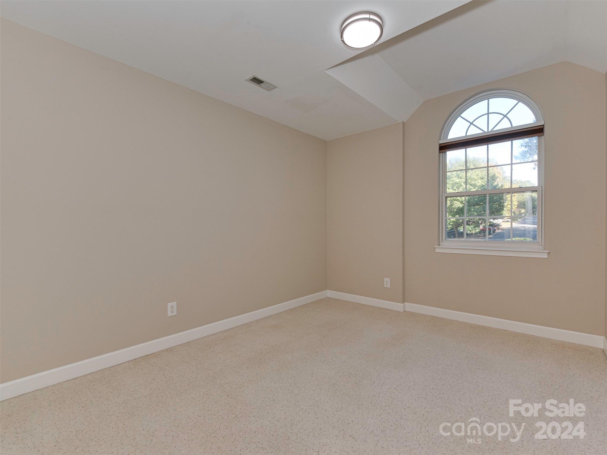 4801 Steepleton Way Charlotte, NC 28215 - Photo 16 of 28 an empty room with windows and closet