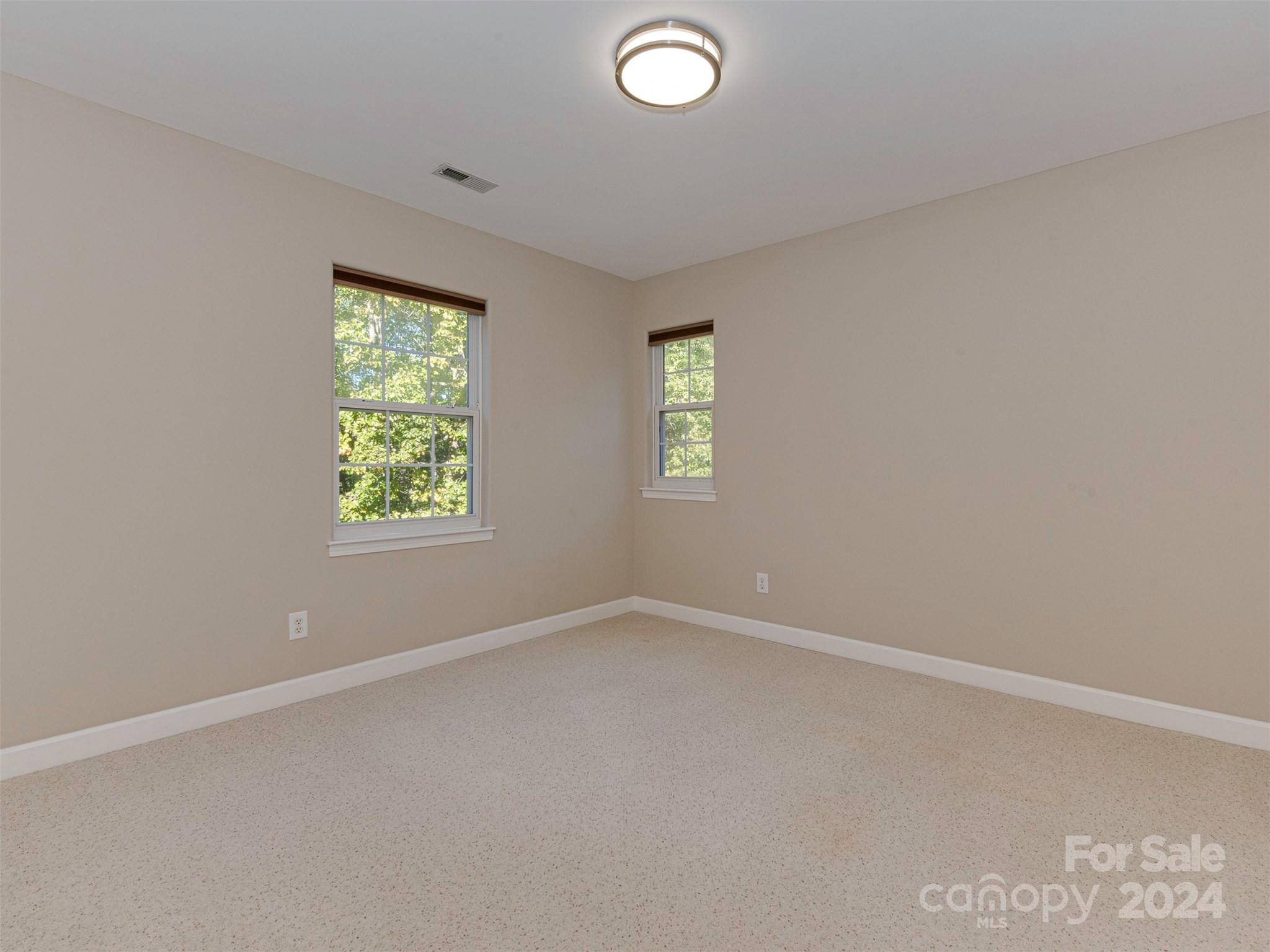 4801 Steepleton Way Charlotte, NC 28215 - Photo 17 of 28 an empty room with a window
