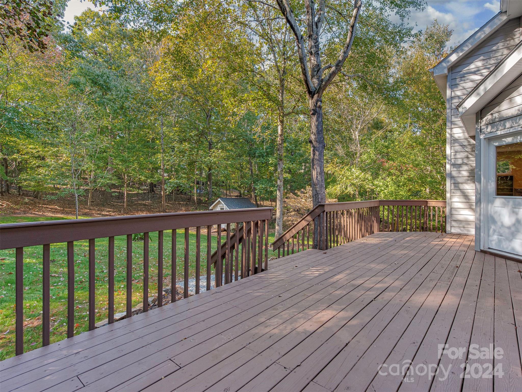 4801 Steepleton Way Charlotte, NC 28215 - Photo 20 of 28 a view of deck with wooden floor and fence