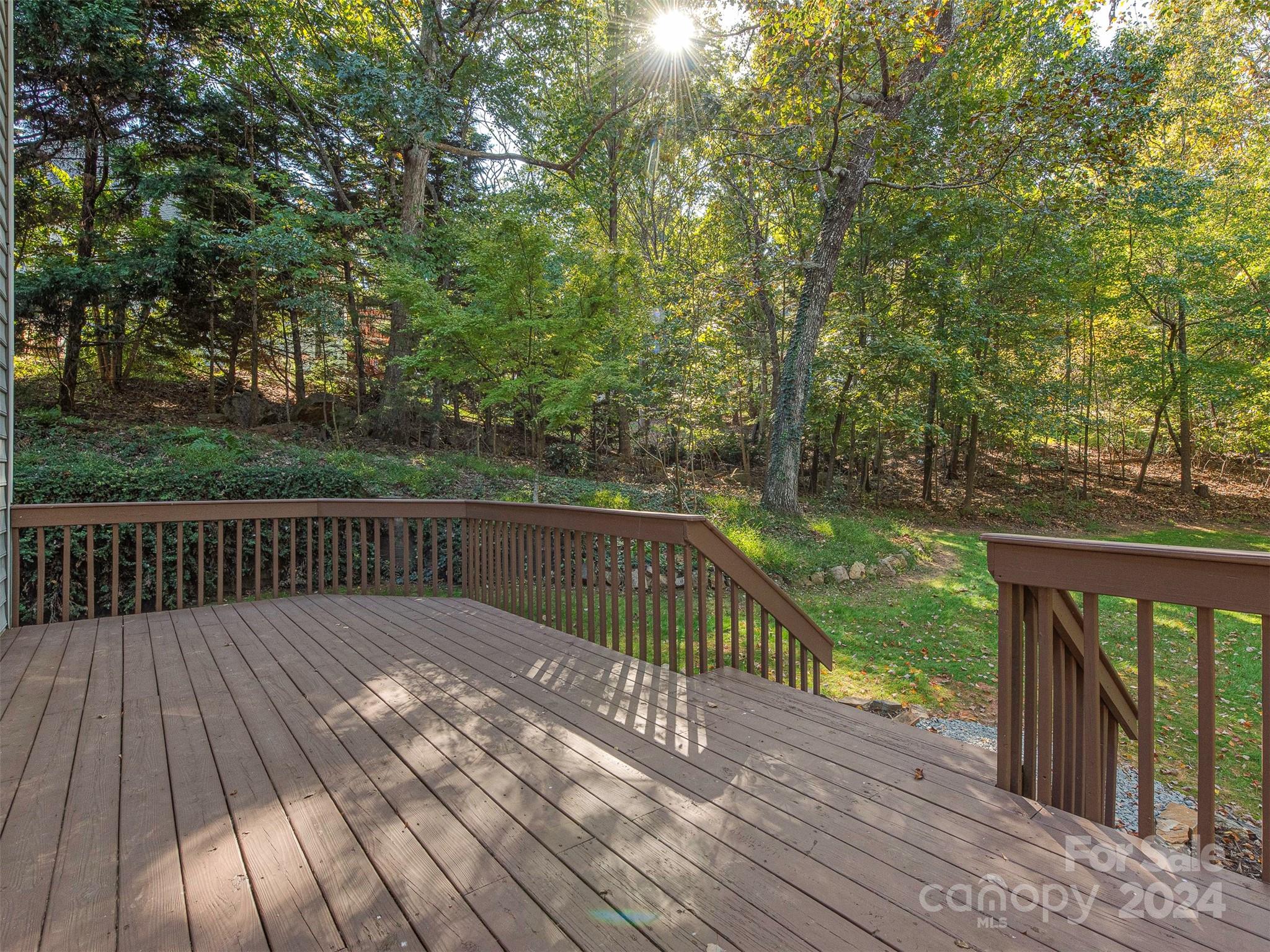 4801 Steepleton Way Charlotte, NC 28215 - Photo 21 of 28 a balcony with wooden floor and trees