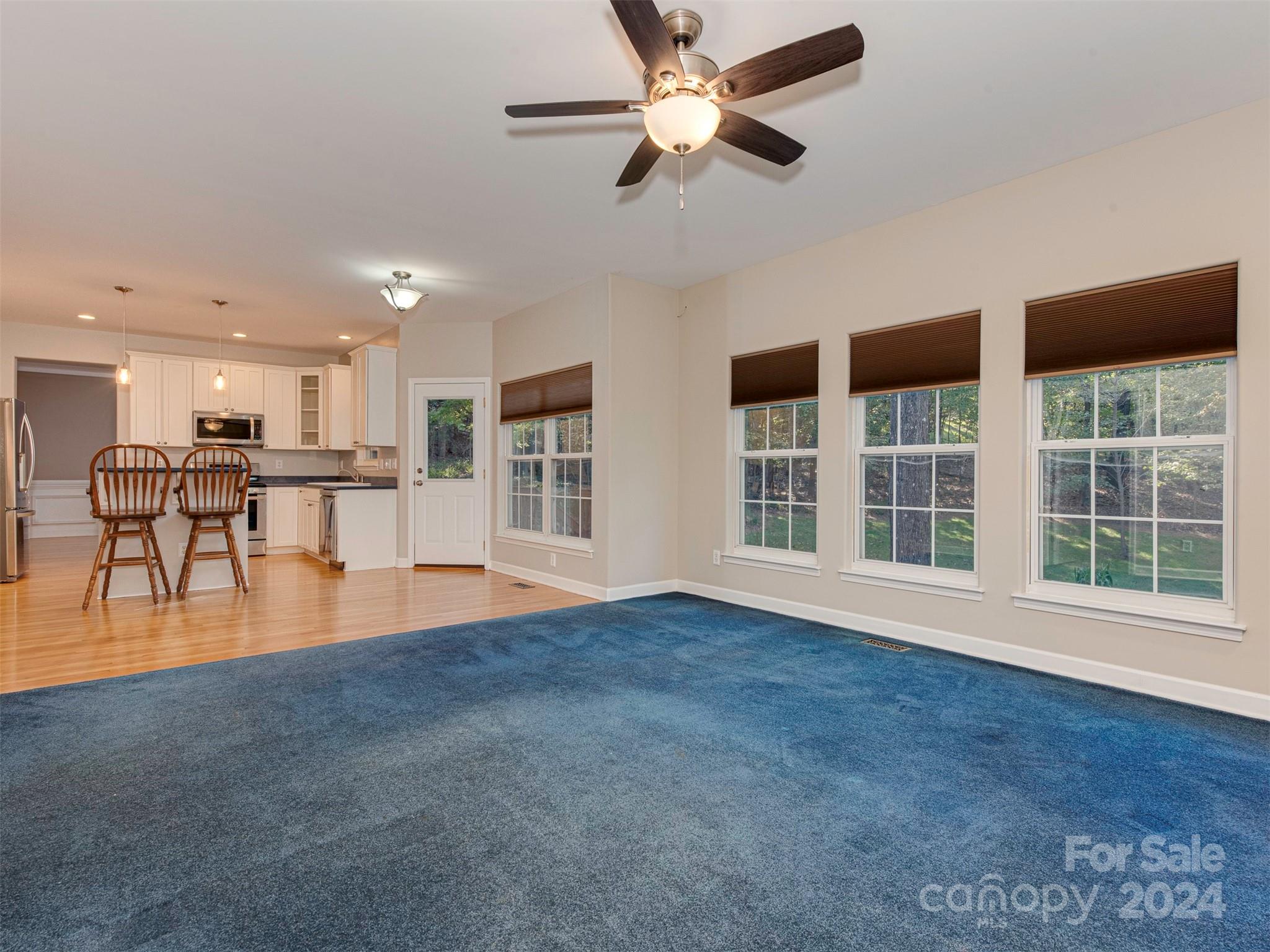 4801 Steepleton Way Charlotte, NC 28215 - Photo 7 of 28 a view of a livingroom with furniture wooden floor and a window