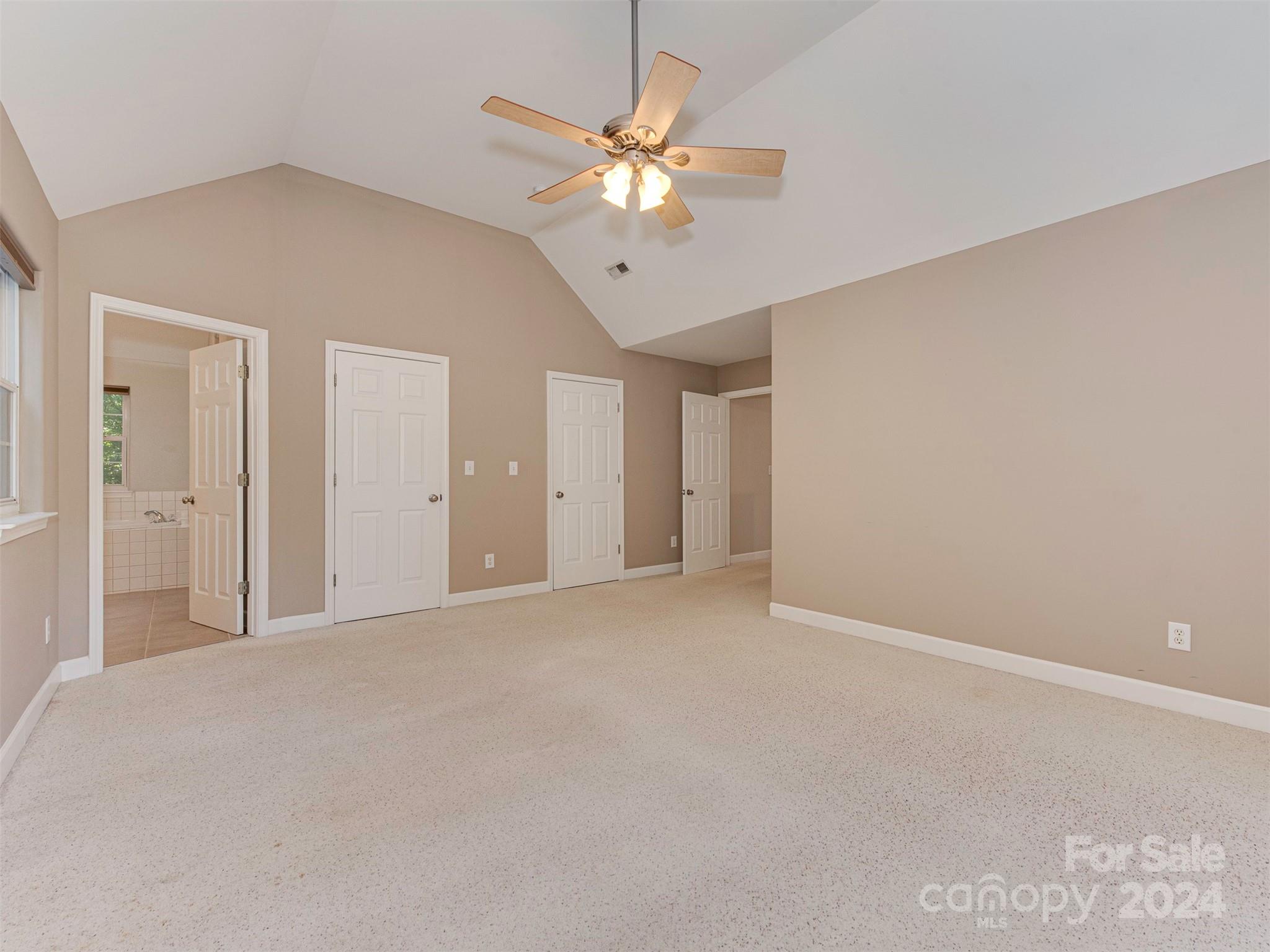 4801 Steepleton Way Charlotte, NC 28215 - Photo 10 of 28 a view of an empty room with a ceiling fan