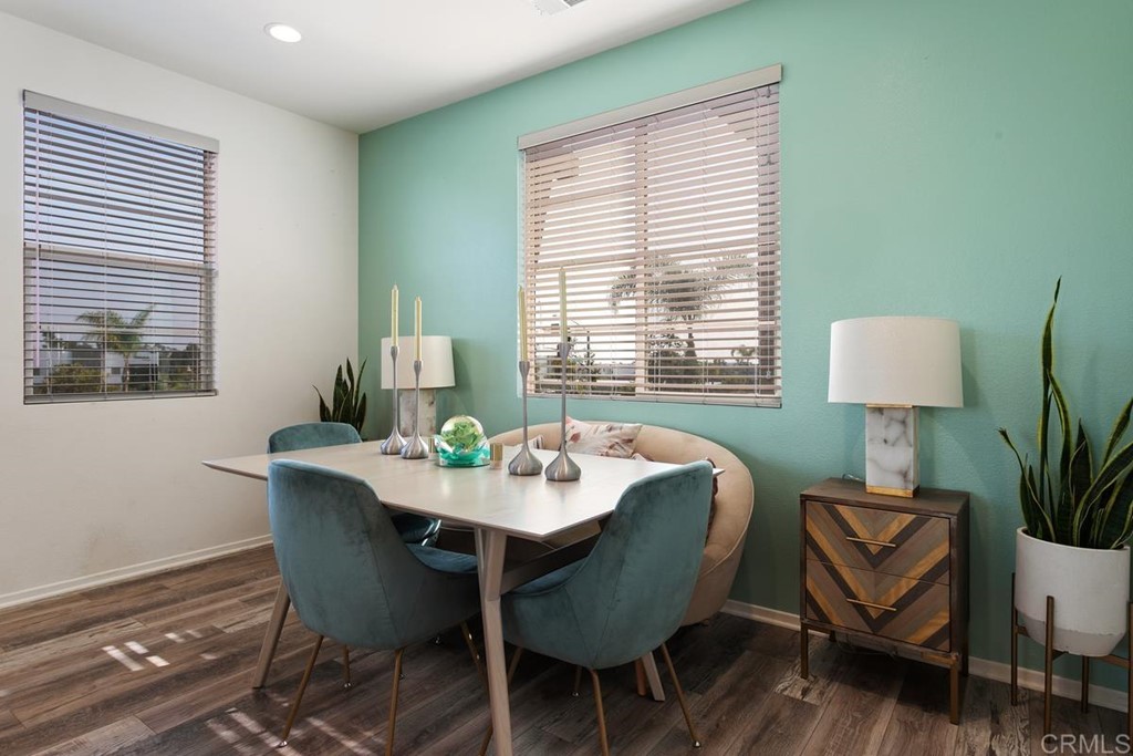 1267 Via Lucero Oceanside, CA 92056 - Photo 18 of 44 a dining room with furniture and wooden floor