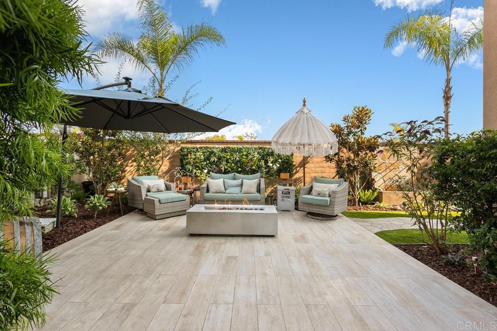 1267 Via Lucero Oceanside, CA 92056 - Photo 3 of 44 a view of a patio with couches and potted plants