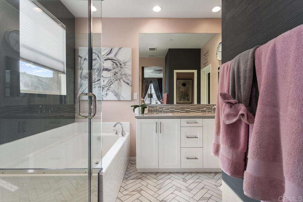 1267 Via Lucero Oceanside, CA 92056 - Photo 26 of 44 a bathroom with a bathtub sink and a mirror