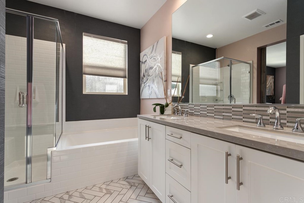 1267 Via Lucero Oceanside, CA 92056 - Photo 27 of 44 a bathroom with a bathtub and a sink