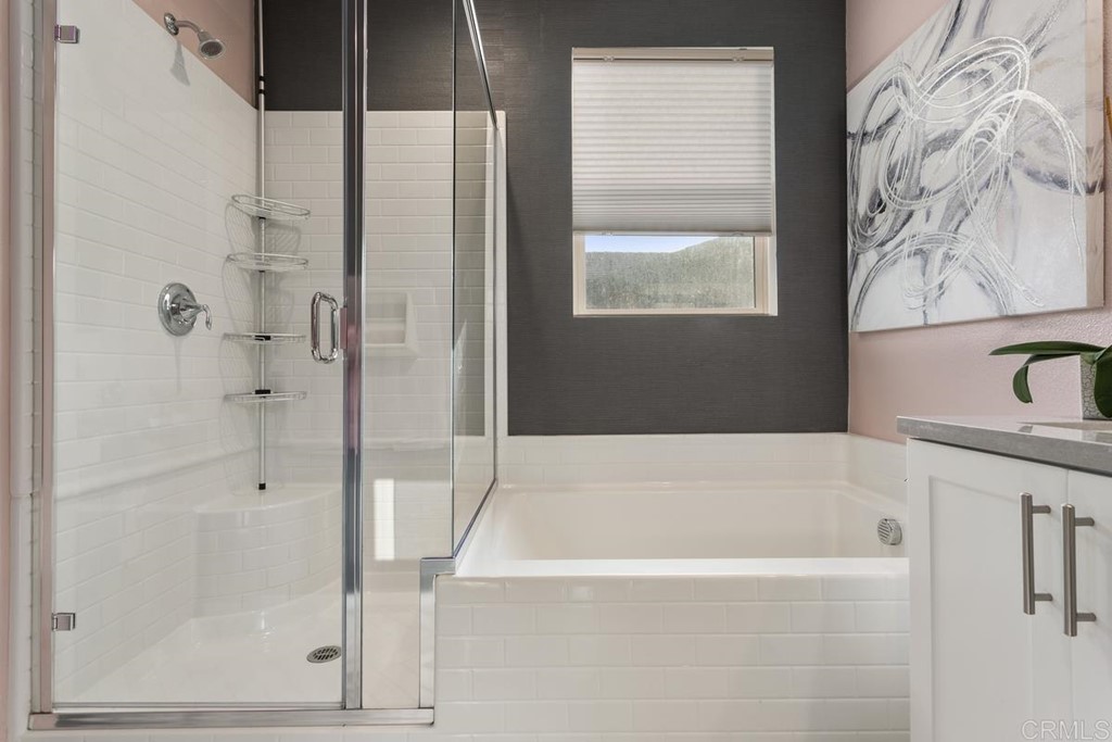 1267 Via Lucero Oceanside, CA 92056 - Photo 28 of 44 a bathroom with a bathtub and a shower