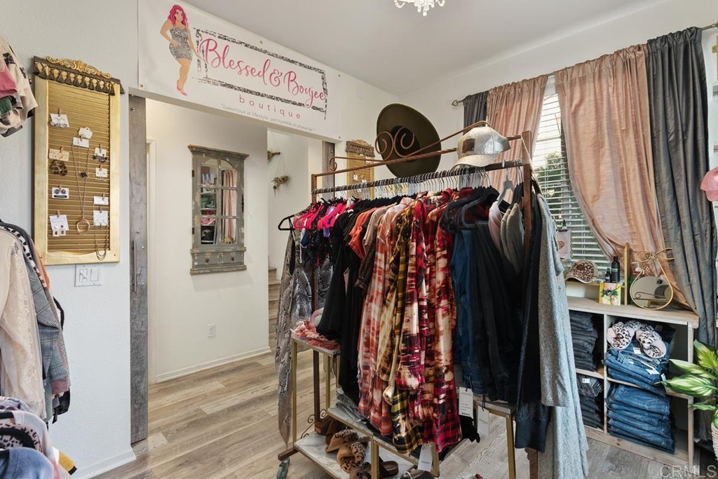 1267 Via Lucero Oceanside, CA 92056 - Photo 34 of 44 a view of walk in closet with clothes and shoes