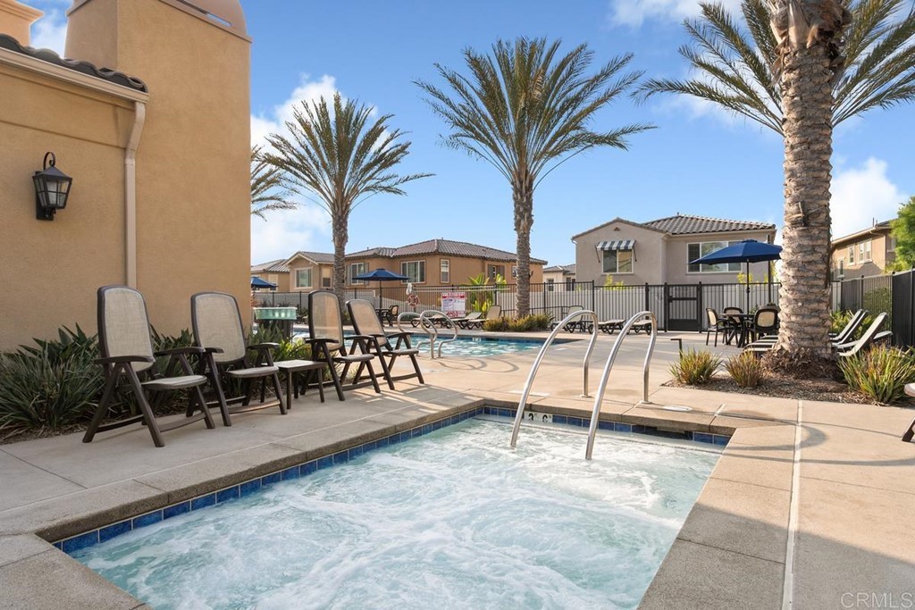 1267 Via Lucero Oceanside, CA 92056 - Photo 39 of 44 a view of a swimming pool with chairs