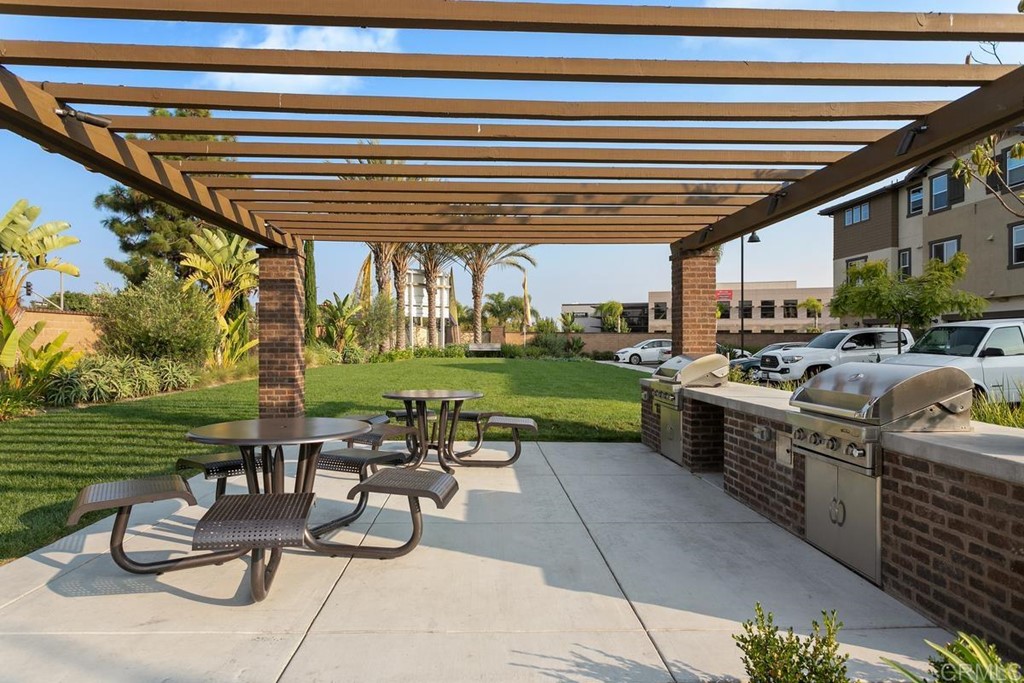 1267 Via Lucero Oceanside, CA 92056 - Photo 40 of 44 a view of a chairs and tables in the patio