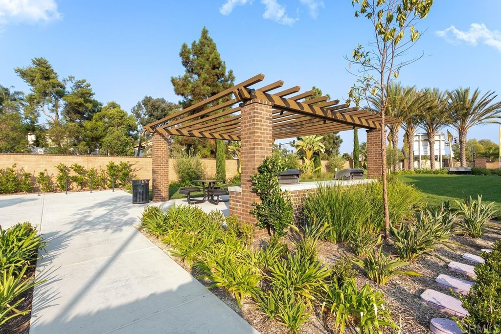 1267 Via Lucero Oceanside, CA 92056 - Photo 43 of 44 a view of a fountain in front of a house with a big yard