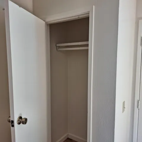 a room with a table and a chandelier