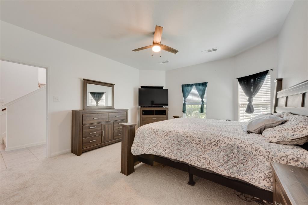 106 Rushmore Lane Venus, TX 76084 - Photo 9 of 25 a bedroom with a large bed and a tv