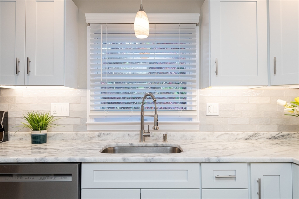 251 Centre Street Danvers, MA 01923 - Photo 17 of 42 a kitchen with sink and wooden floor