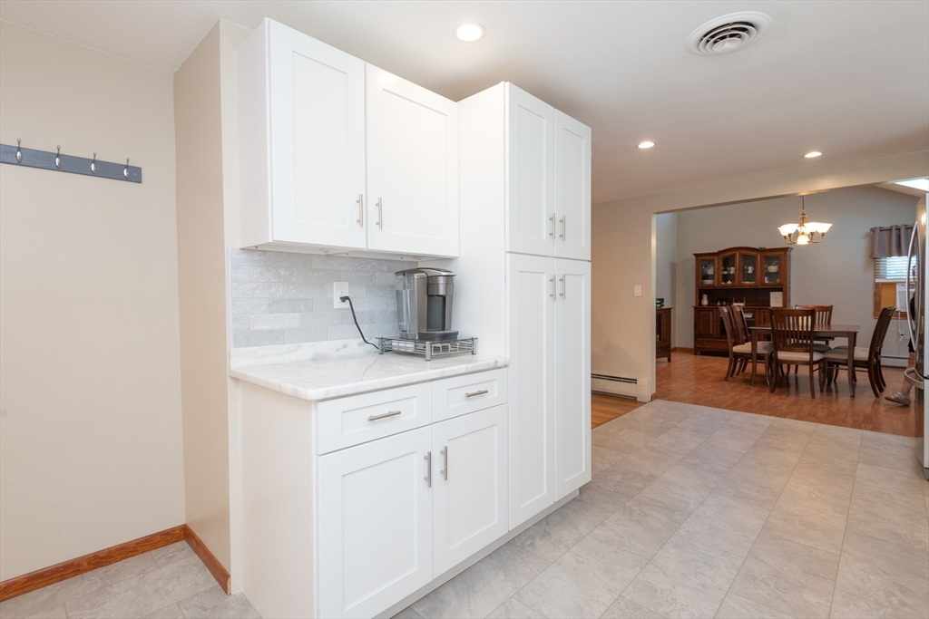 251 Centre Street Danvers, MA 01923 - Photo 18 of 42 a kitchen with stainless steel appliances a sink stove and cabinets