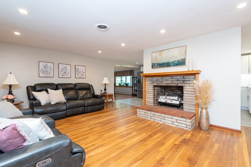 251 Centre Street Danvers, MA 01923 - Photo 22 of 42 a living room with furniture and a fireplace