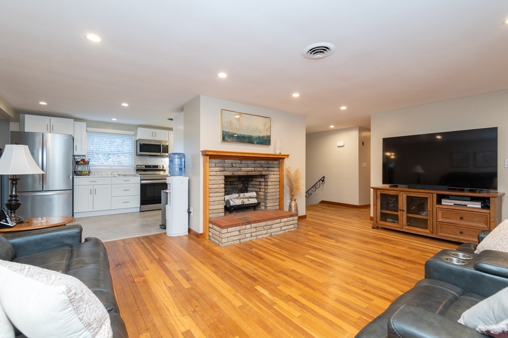 251 Centre Street Danvers, MA 01923 - Photo 23 of 42 a living room with furniture and a flat screen tv
