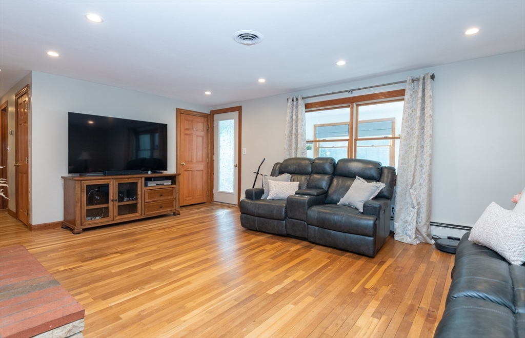 251 Centre Street Danvers, MA 01923 - Photo 24 of 42 a living room with furniture and a flat screen tv