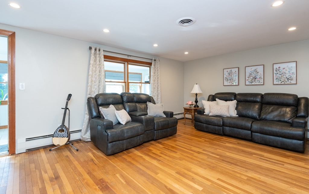 251 Centre Street Danvers, MA 01923 - Photo 25 of 42 a living room with furniture and a flat screen tv