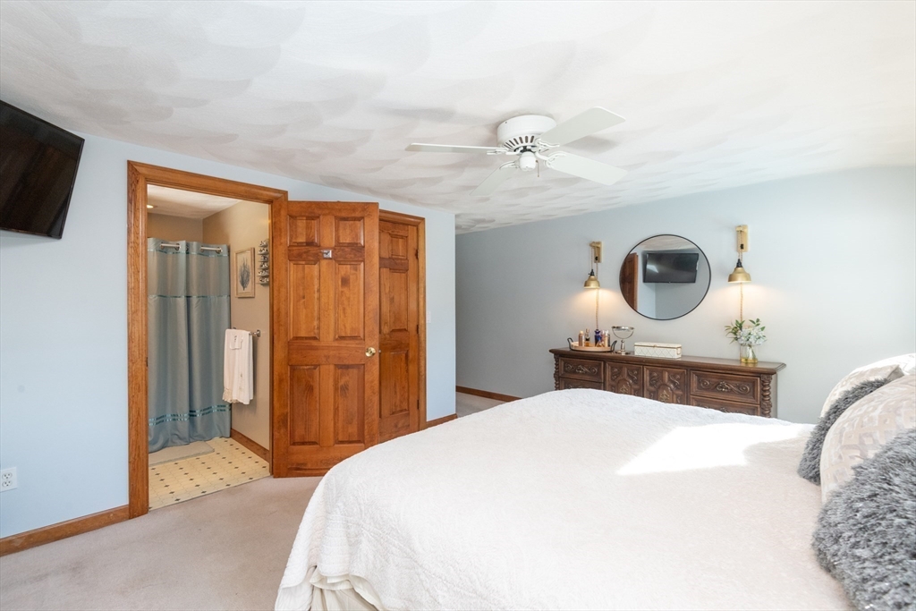 251 Centre Street Danvers, MA 01923 - Photo 32 of 42 a bedroom with a bed and a flat screen tv