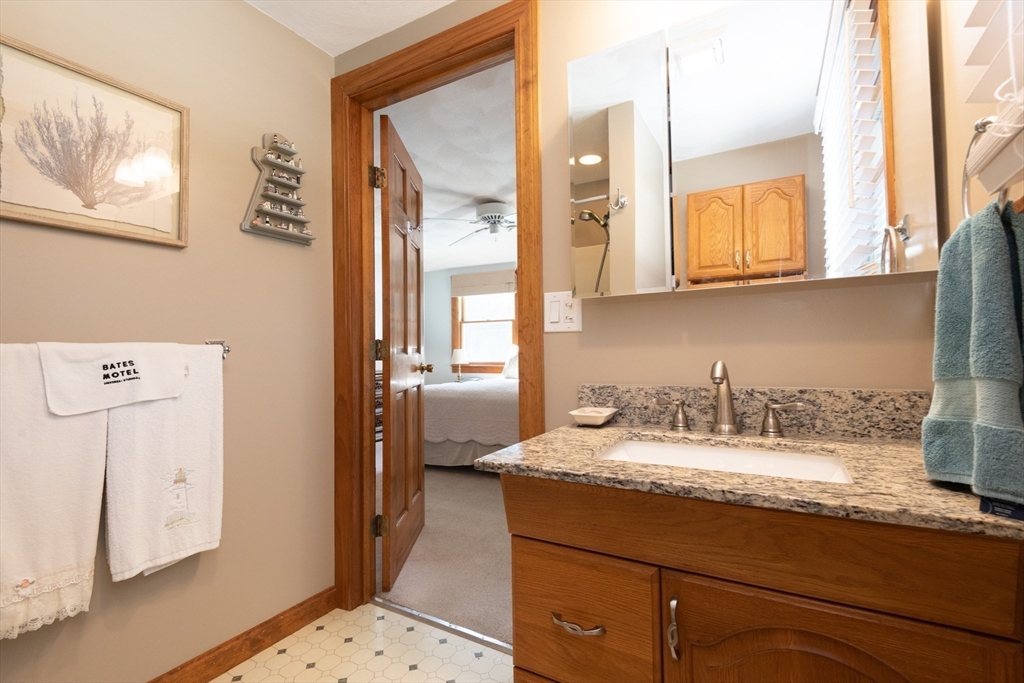 251 Centre Street Danvers, MA 01923 - Photo 33 of 42 a bathroom with a sink and a mirror