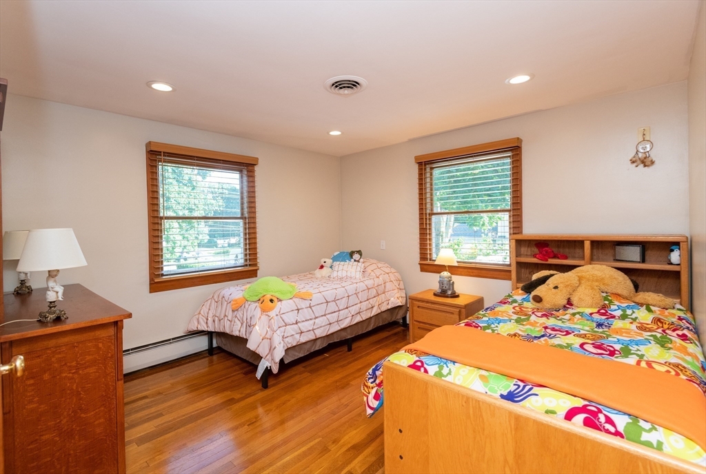 251 Centre Street Danvers, MA 01923 - Photo 35 of 42 a bedroom with two beds and a window