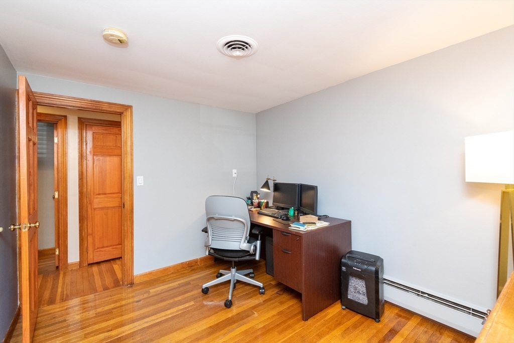 251 Centre Street Danvers, MA 01923 - Photo 37 of 42 a view of a workspace with furniture and wooden floor