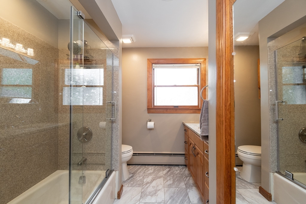 251 Centre Street Danvers, MA 01923 - Photo 38 of 42 a bathroom with a bathtub and toilet