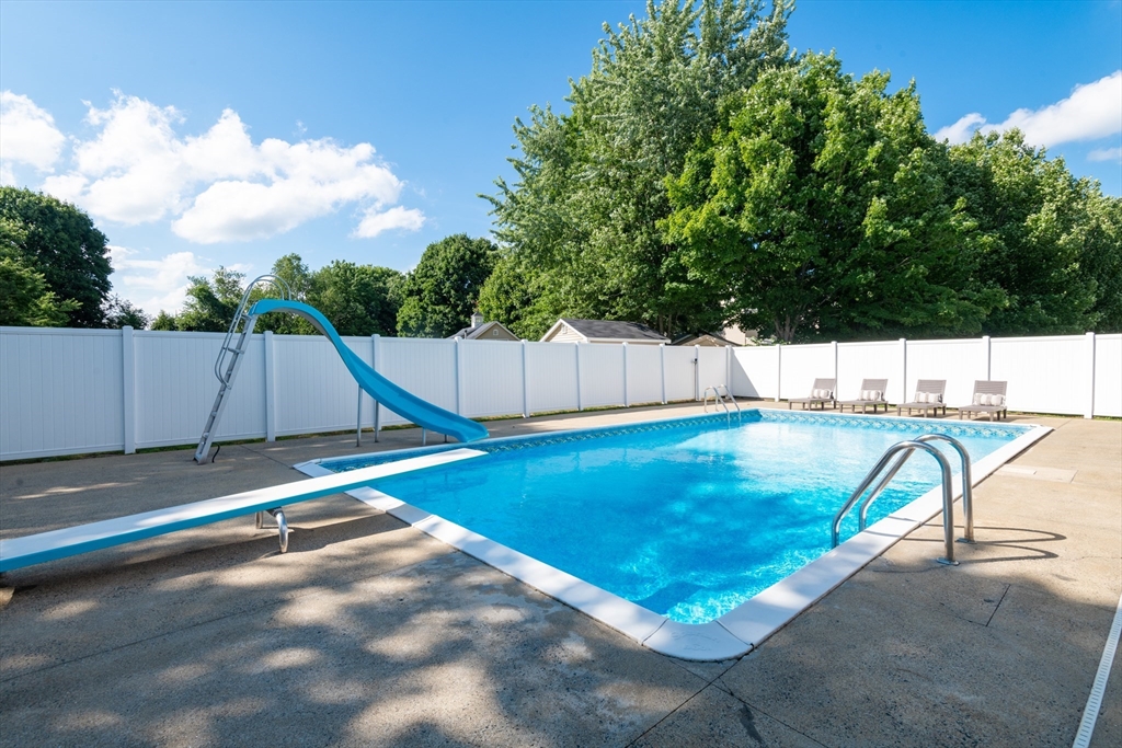 251 Centre Street Danvers, MA 01923 - Photo 8 of 42 a view of a pool in a backyard