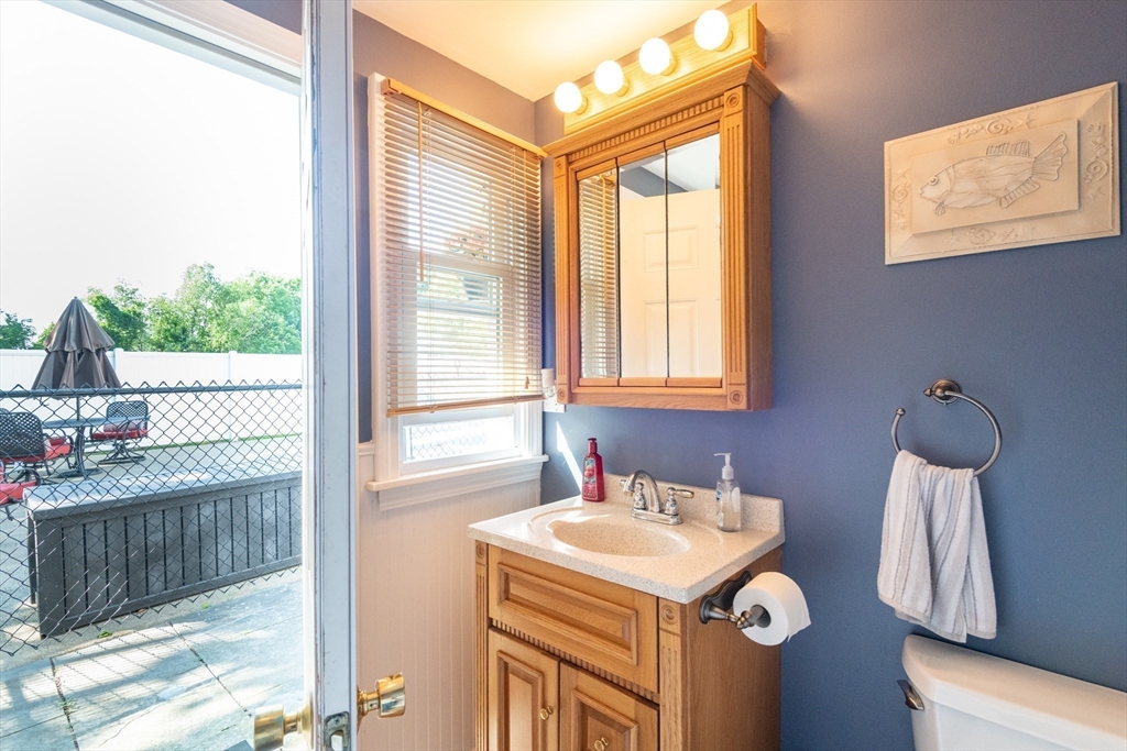 251 Centre Street Danvers, MA 01923 - Photo 9 of 42 a bathroom with a sink a toilet and a shower