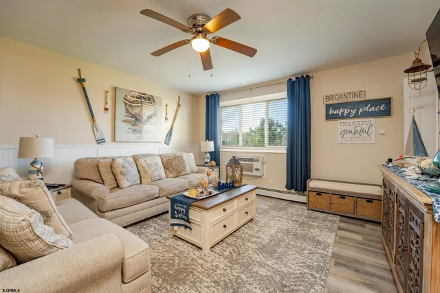 a living room with furniture and a window