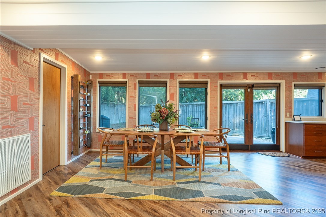 2210 Winterlochen Road Fayetteville, NC 28305 - Photo 25 of 42 a view of a dining room with furniture wooden floor and chandelier
