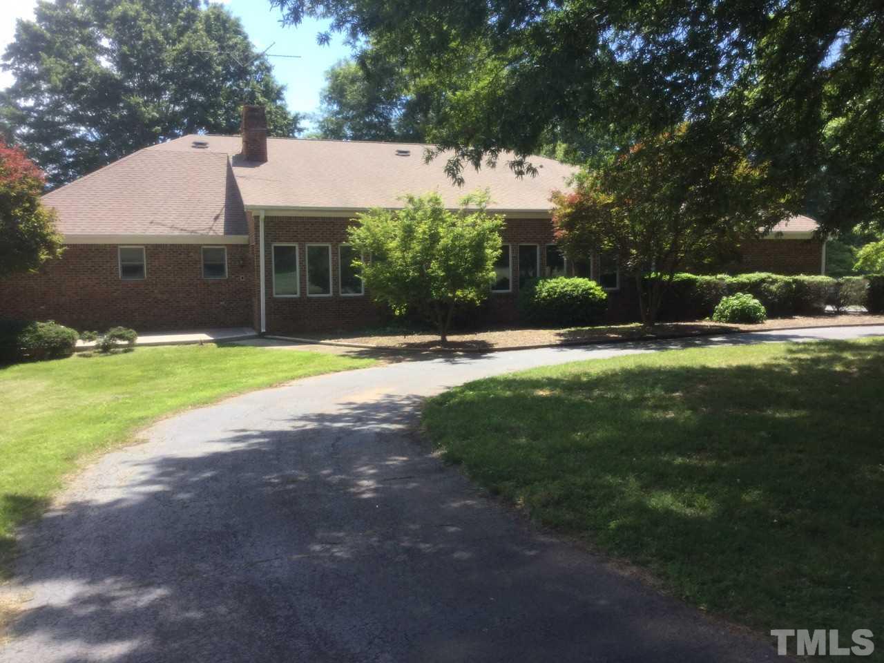 9919 Quail Roost Road Bahama, NC 27503 - Photo 1 of 25 All brick. Looks over pasture area. Home located in middle of property.