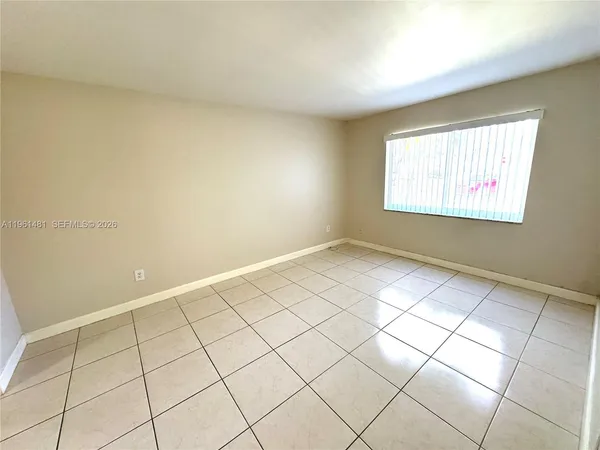 a view of an empty room and window