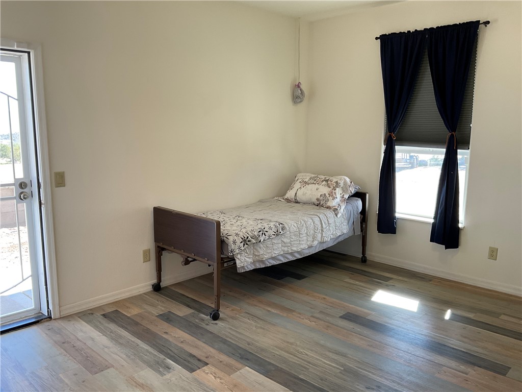 1790 Gleeson Road Golden Valley, AZ 86413 - Photo 36 of 62 Bedroom with access to exterior and wood finished floors
