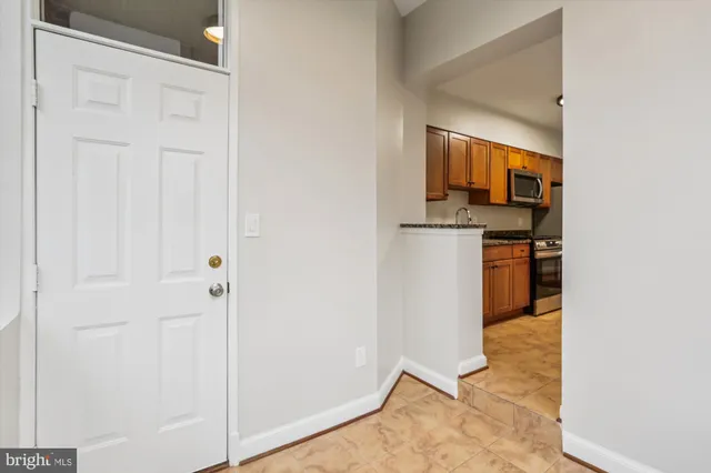 a view of a kitchen from the hallway