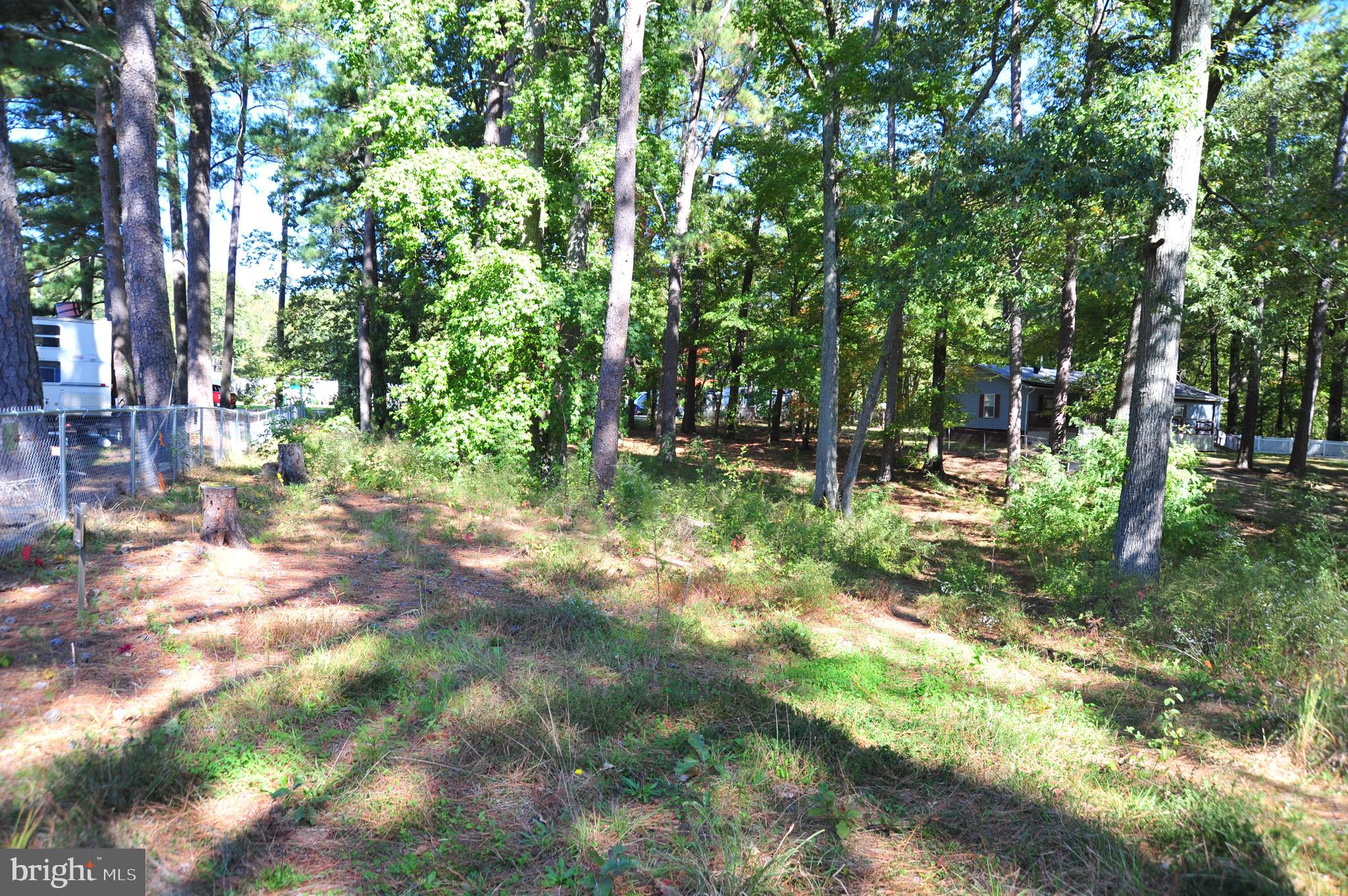 48595 Sea Side View Road Ridge, MD 20680 - Photo 11 of 18 Fenced boundary line with RV Campground.