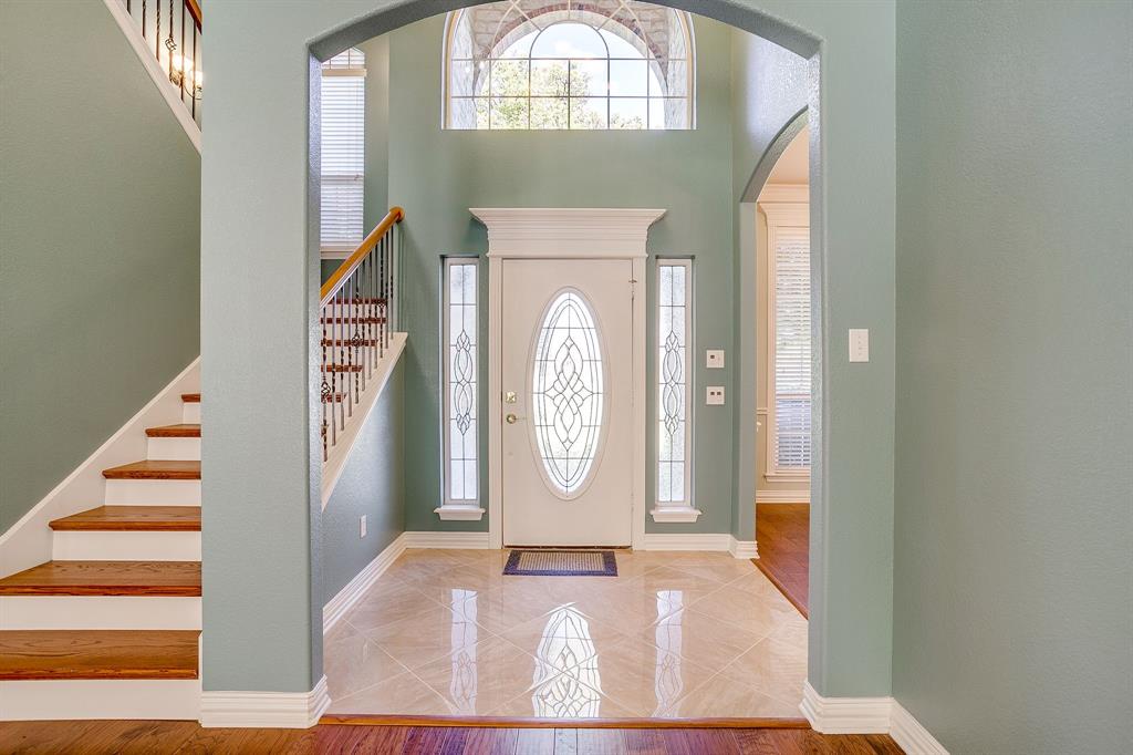 312 Oak Ridge Drive Burleson, TX 76028 - Photo 11 of 40 a view of an entryway with wooden floor