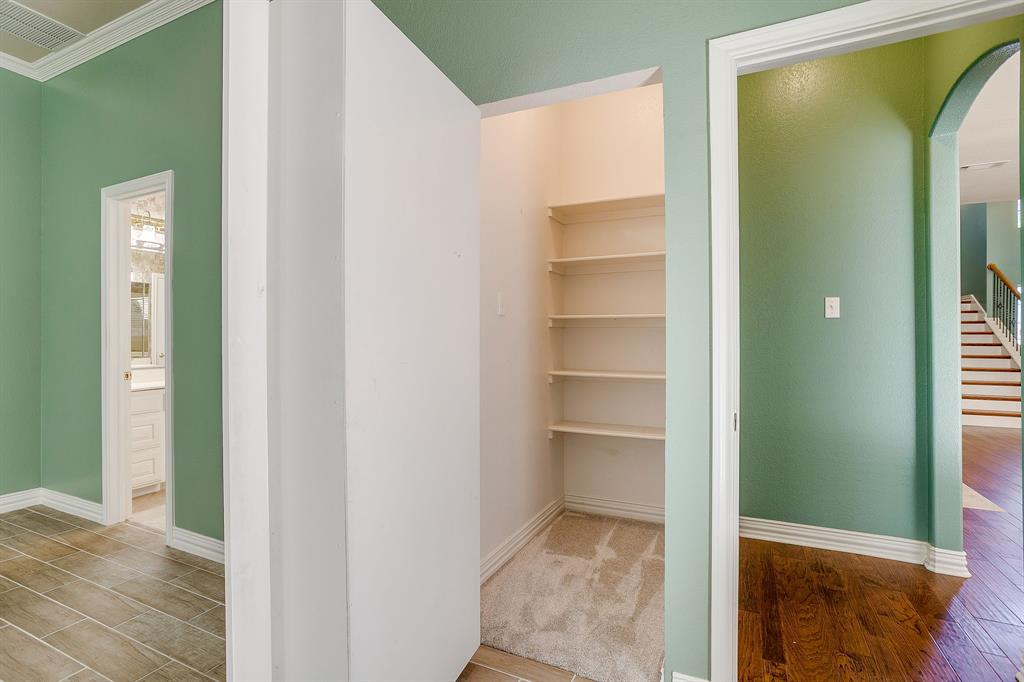 312 Oak Ridge Drive Burleson, TX 76028 - Photo 28 of 40 a view of a hallway with wooden floor and closet