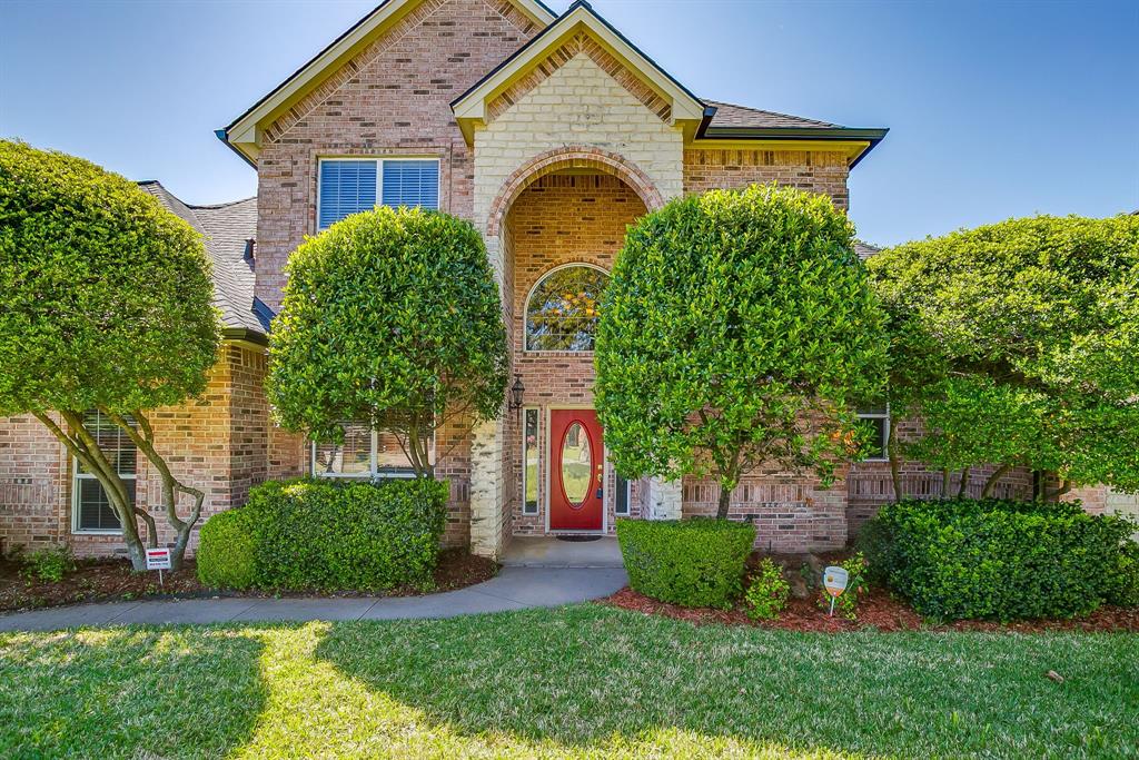 312 Oak Ridge Drive Burleson, TX 76028 - Photo 4 of 40 a front view of a house with garden