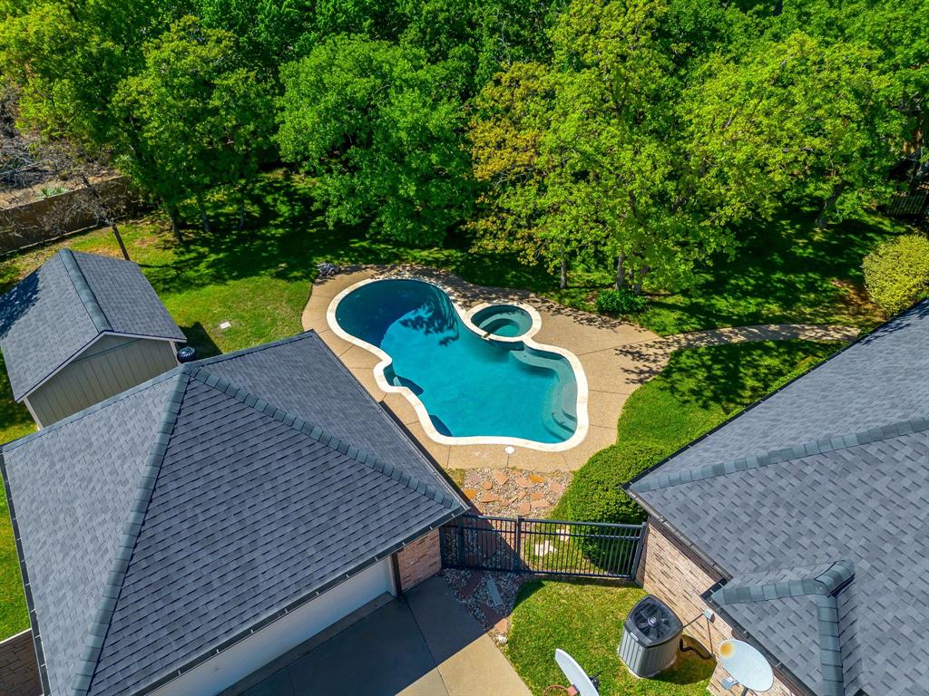 312 Oak Ridge Drive Burleson, TX 76028 - Photo 10 of 40 a view of a wooden deck and a backyard